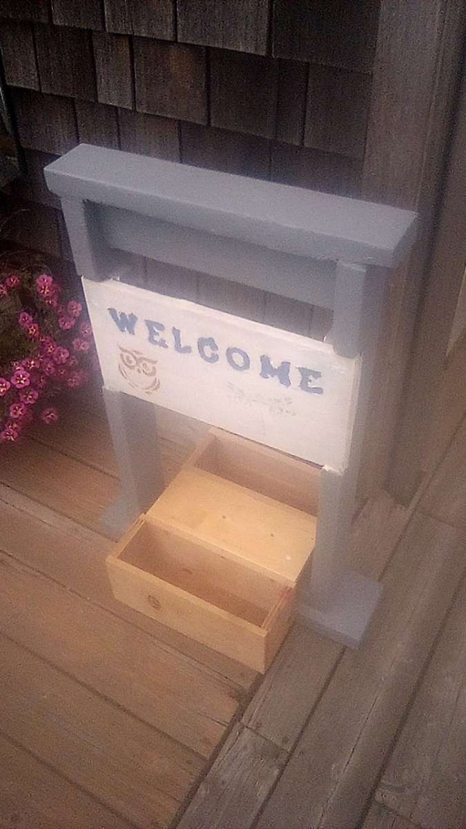 welcome sign with planters
