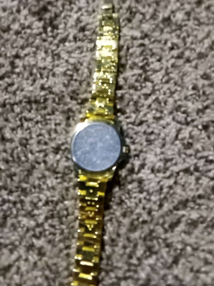fake diamond and gold watch