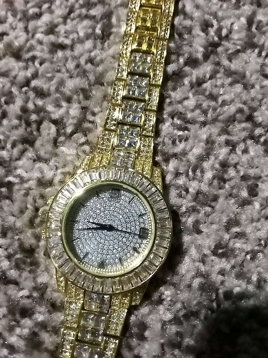 fake diamond and gold watch