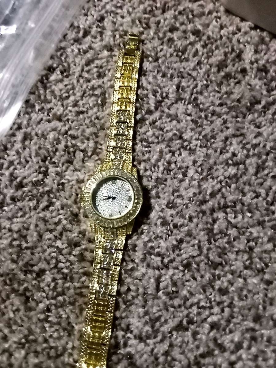 fake diamond and gold watch