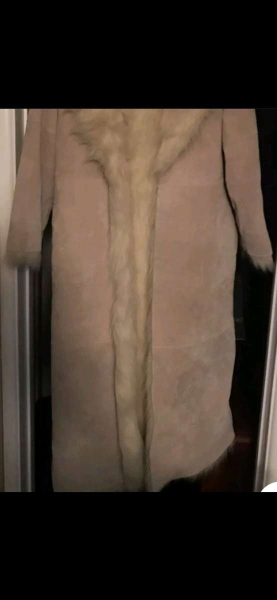 Long leather trench coat with faux fur