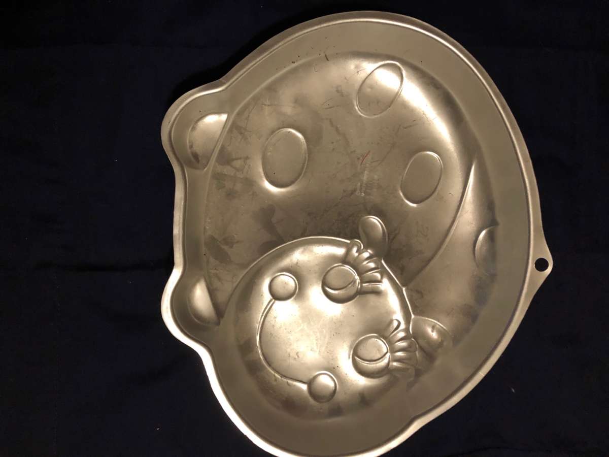 This is a Wilton cake pan it is vintage Lady Bug