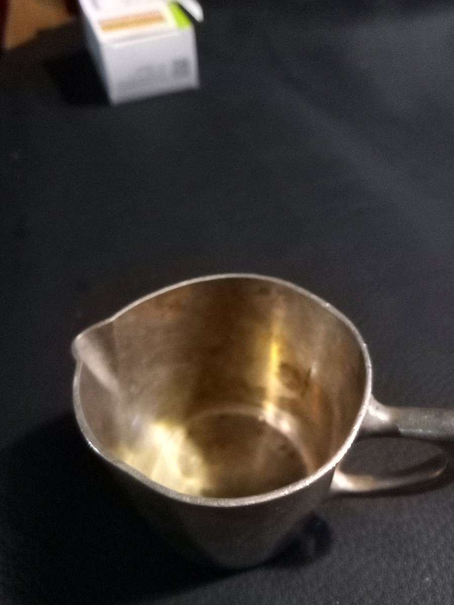 miniature silver water pitcher
