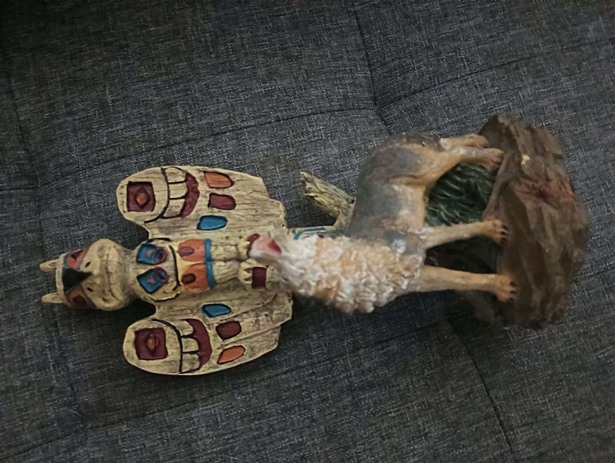 wolf and tiki statue