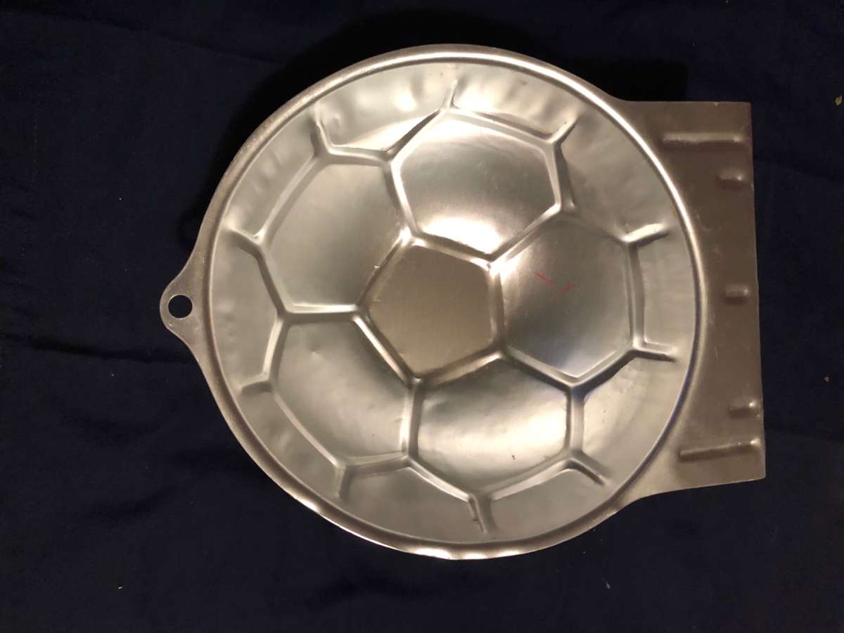 Its a vintage Wilton bake pan its a Soccer ball