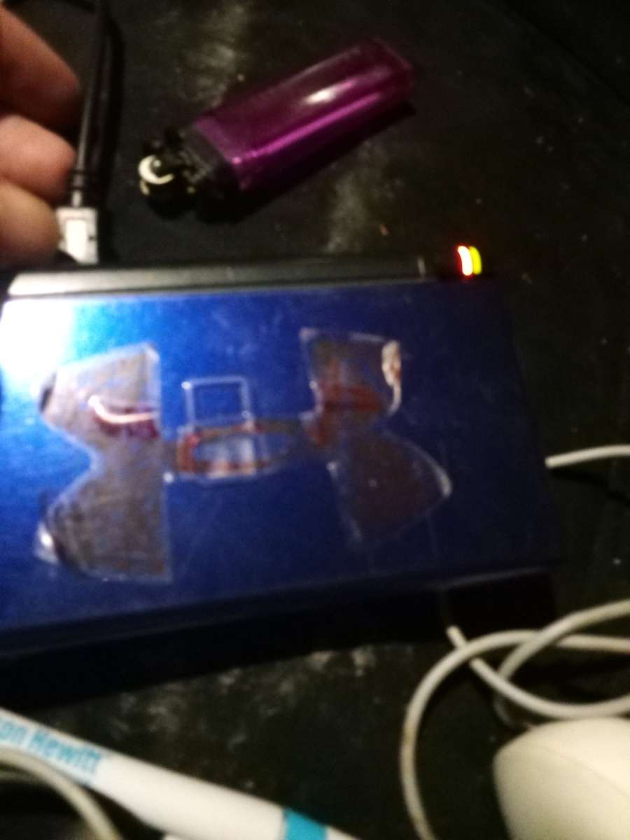 Nintendo DS with game and charger and pen