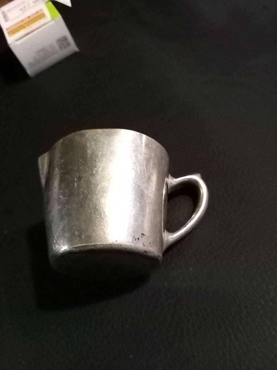 miniature silver water pitcher