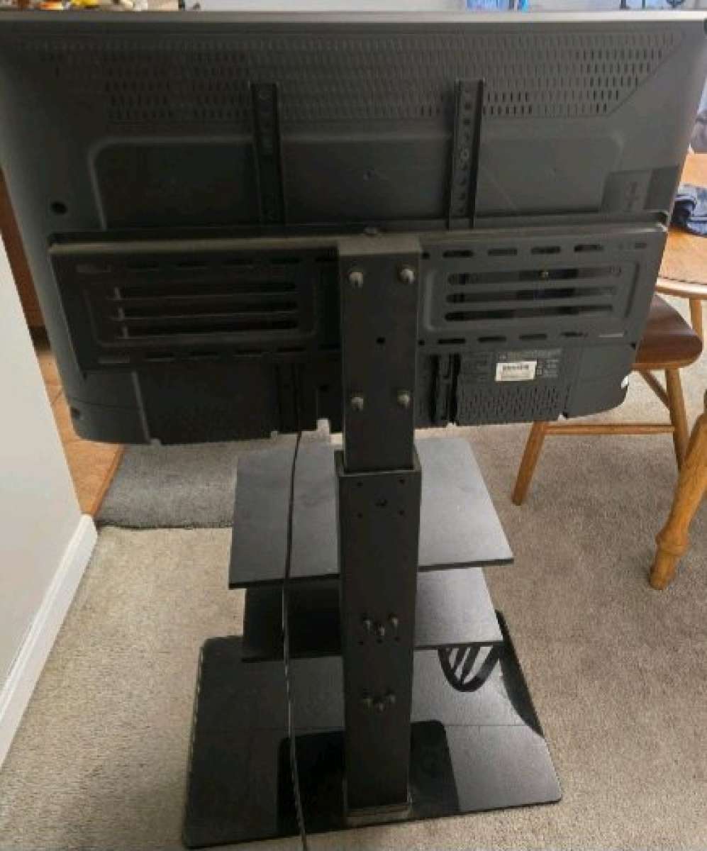 30 inch Emerson flat screen smart tv and 3 shelf TV stand