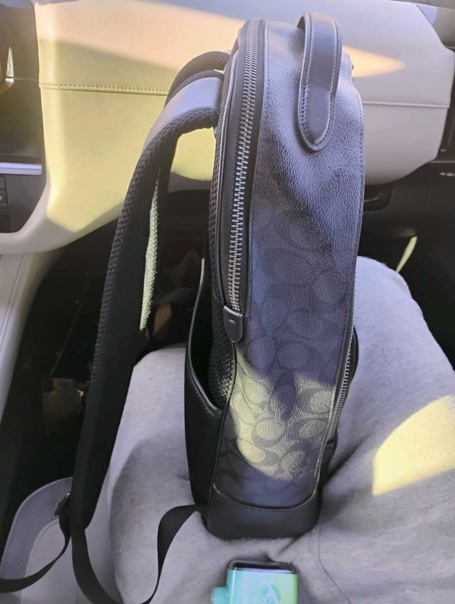 black leather Coach backpack