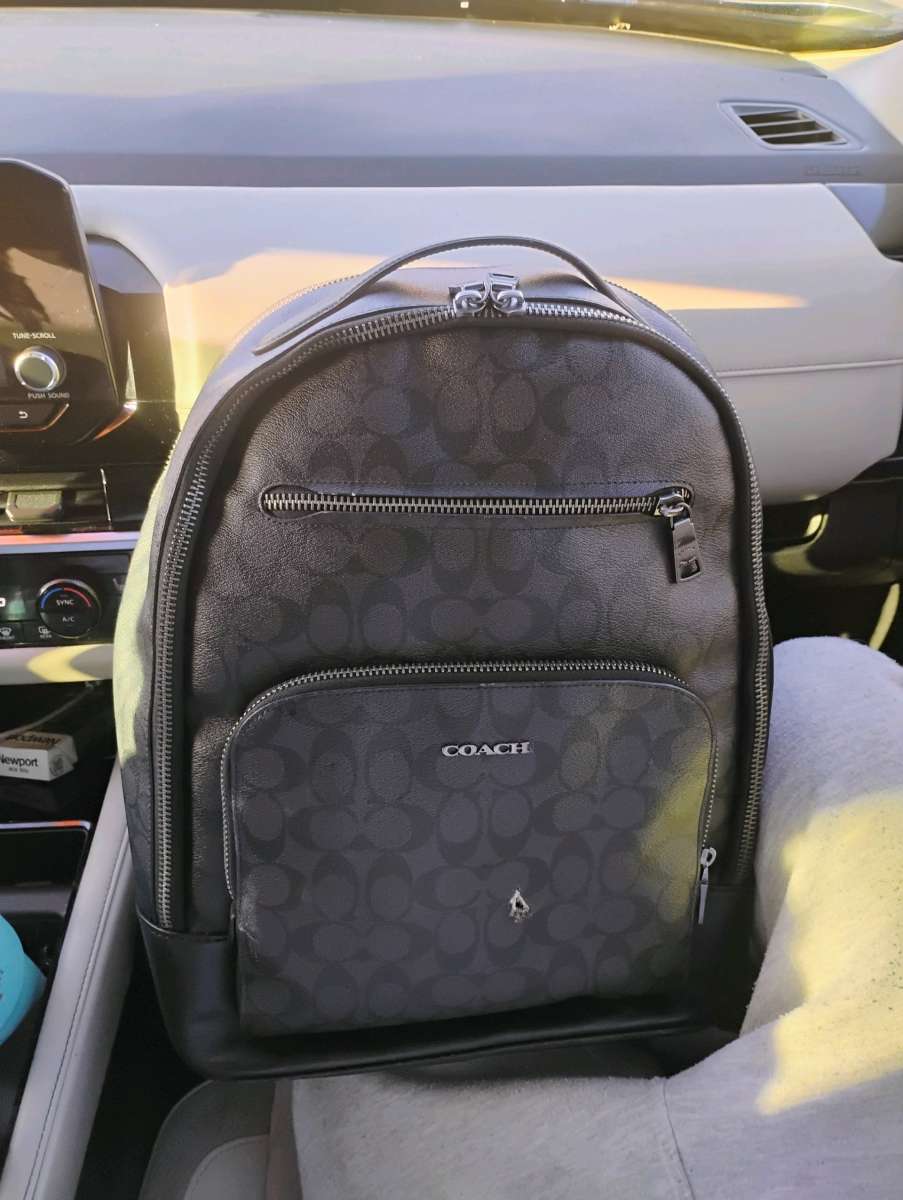 black leather Coach backpack