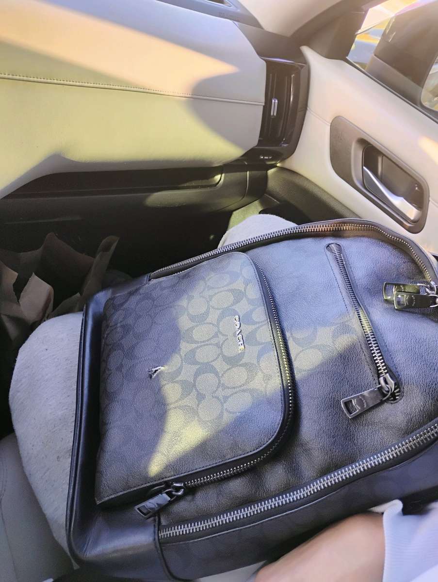 black leather Coach backpack