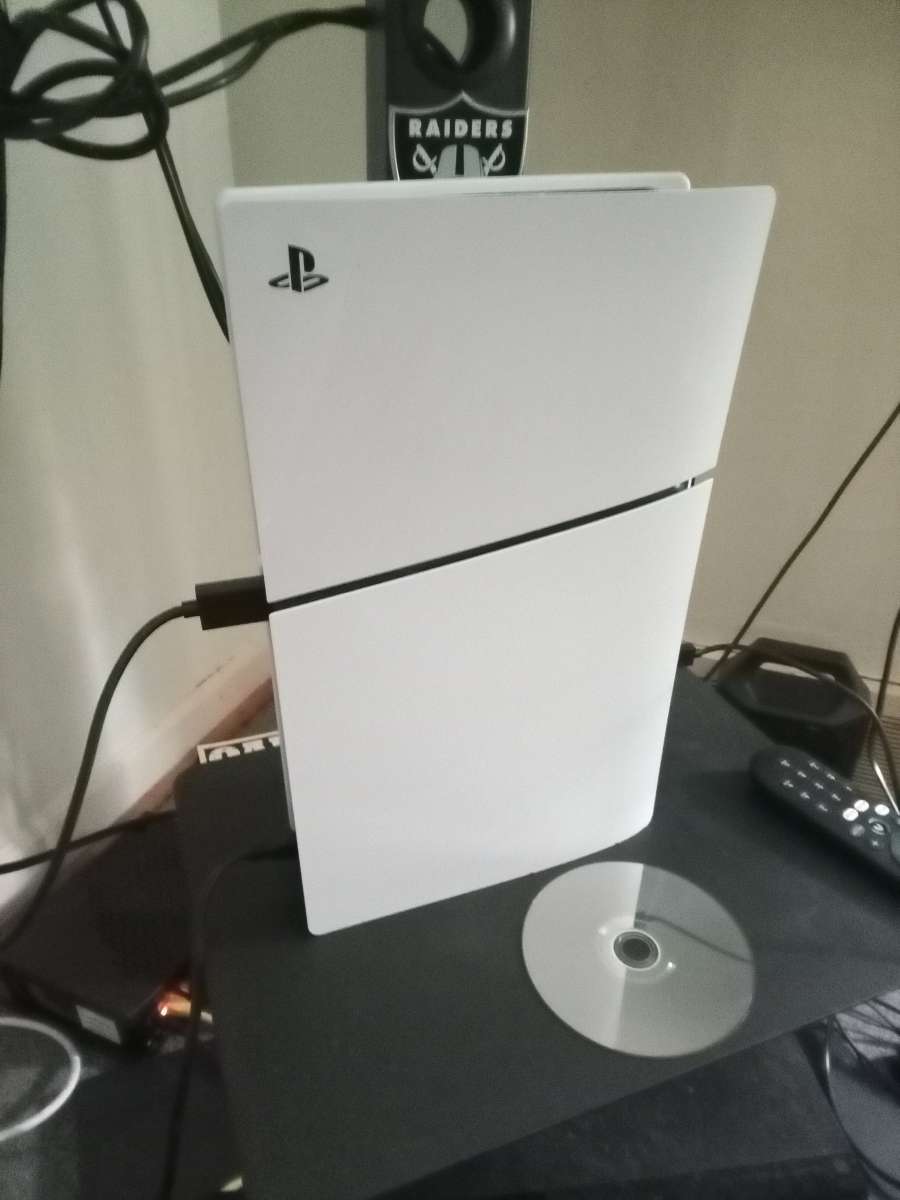 ps5 with 1 controller and 3 games
