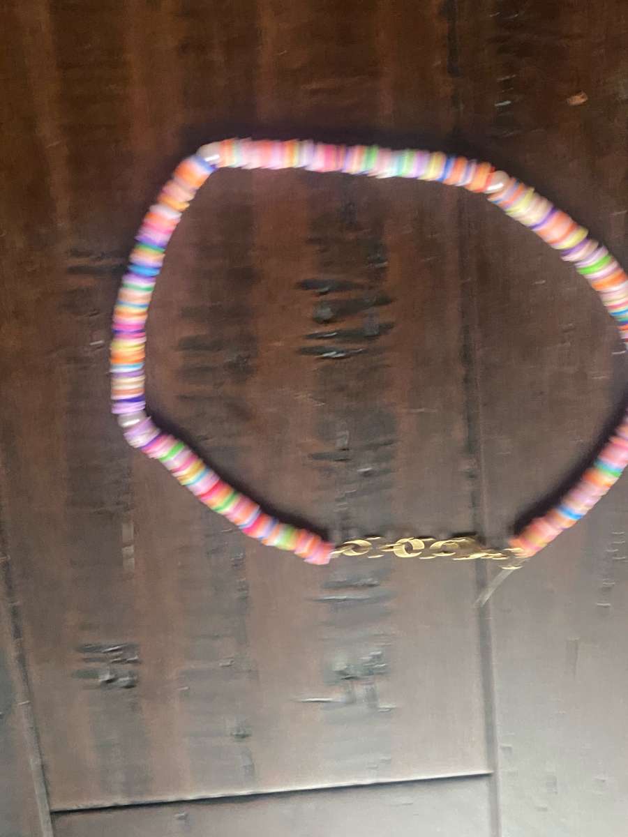 Beachy orangey necklace with pearls with different levels