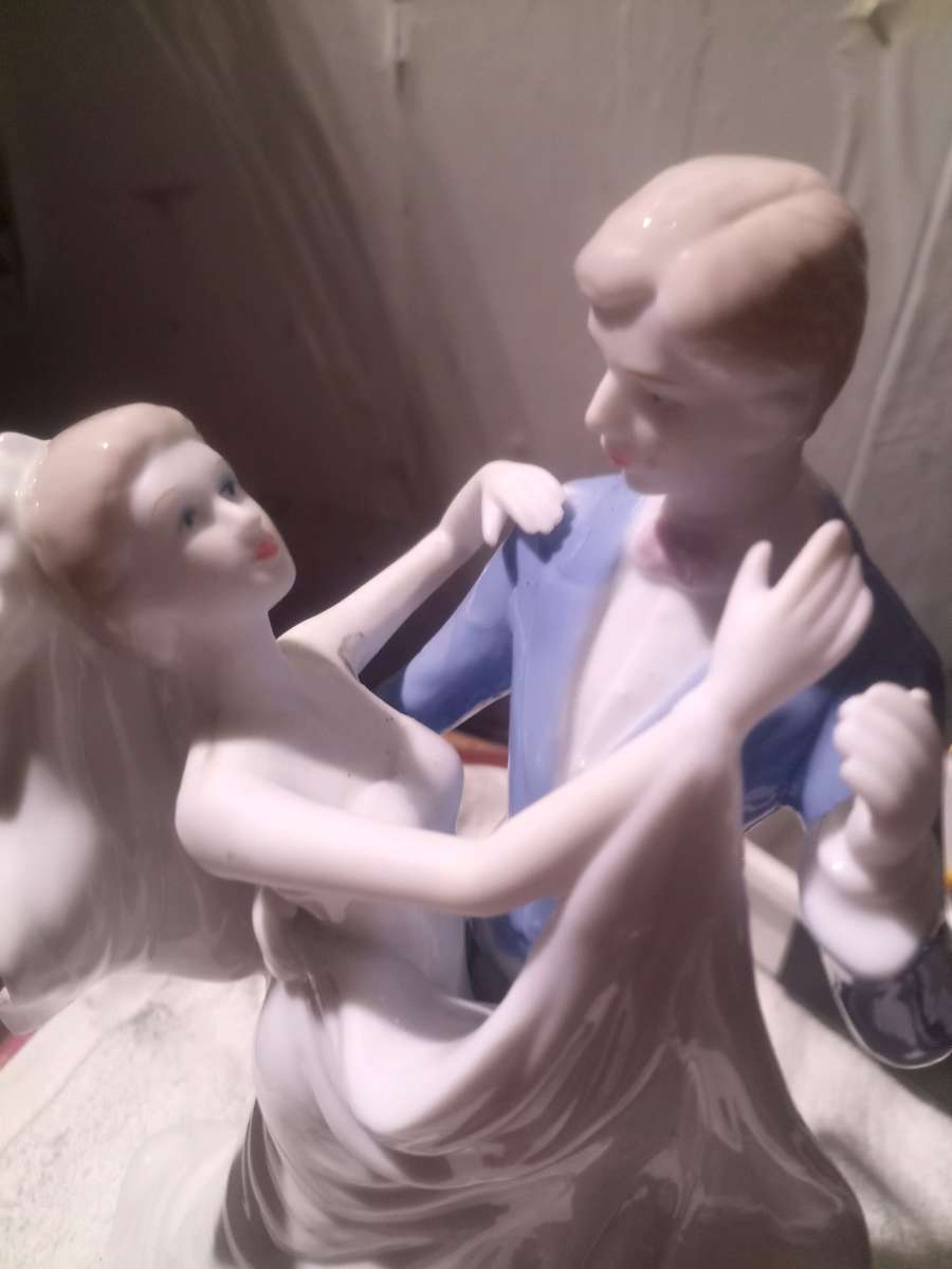 porcelain wedding figurine of man and woman