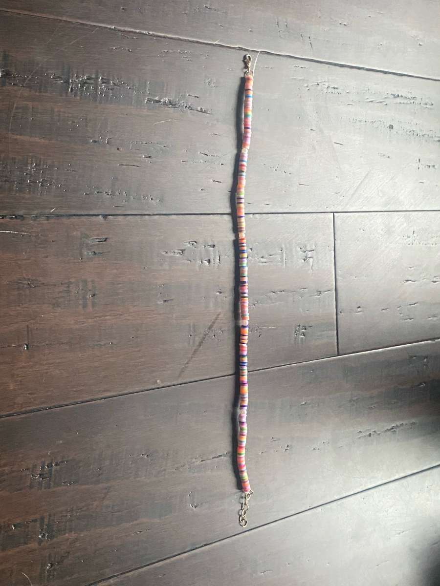 Beachy orangey necklace with pearls with different levels