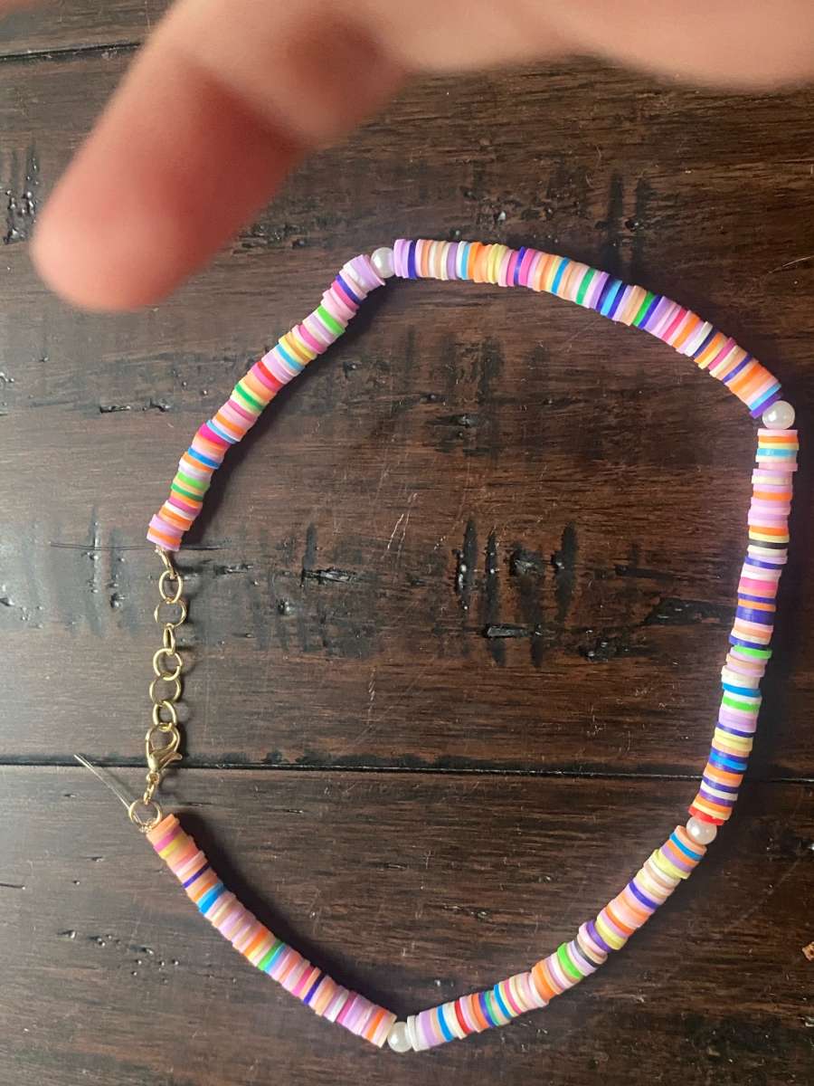 Beachy orangey necklace with pearls with different levels