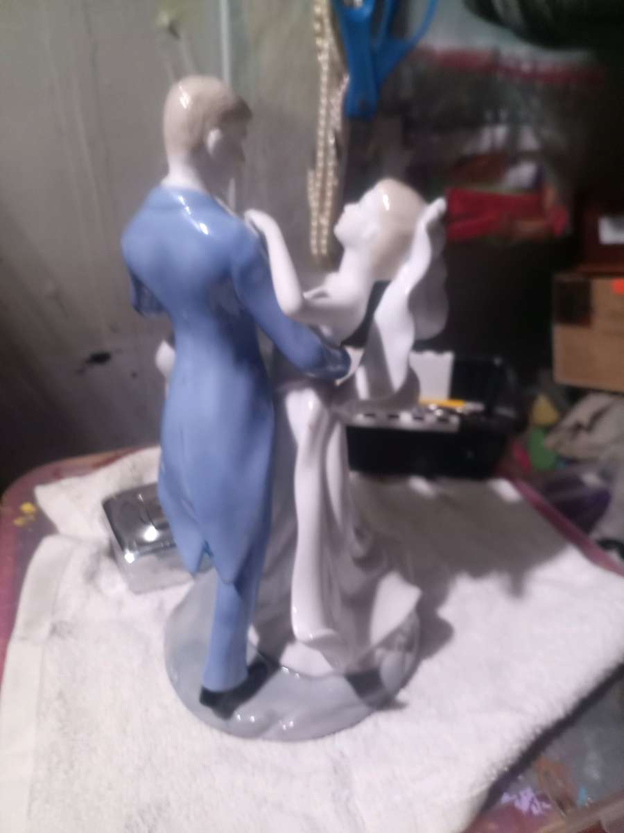 porcelain wedding figurine of man and woman
