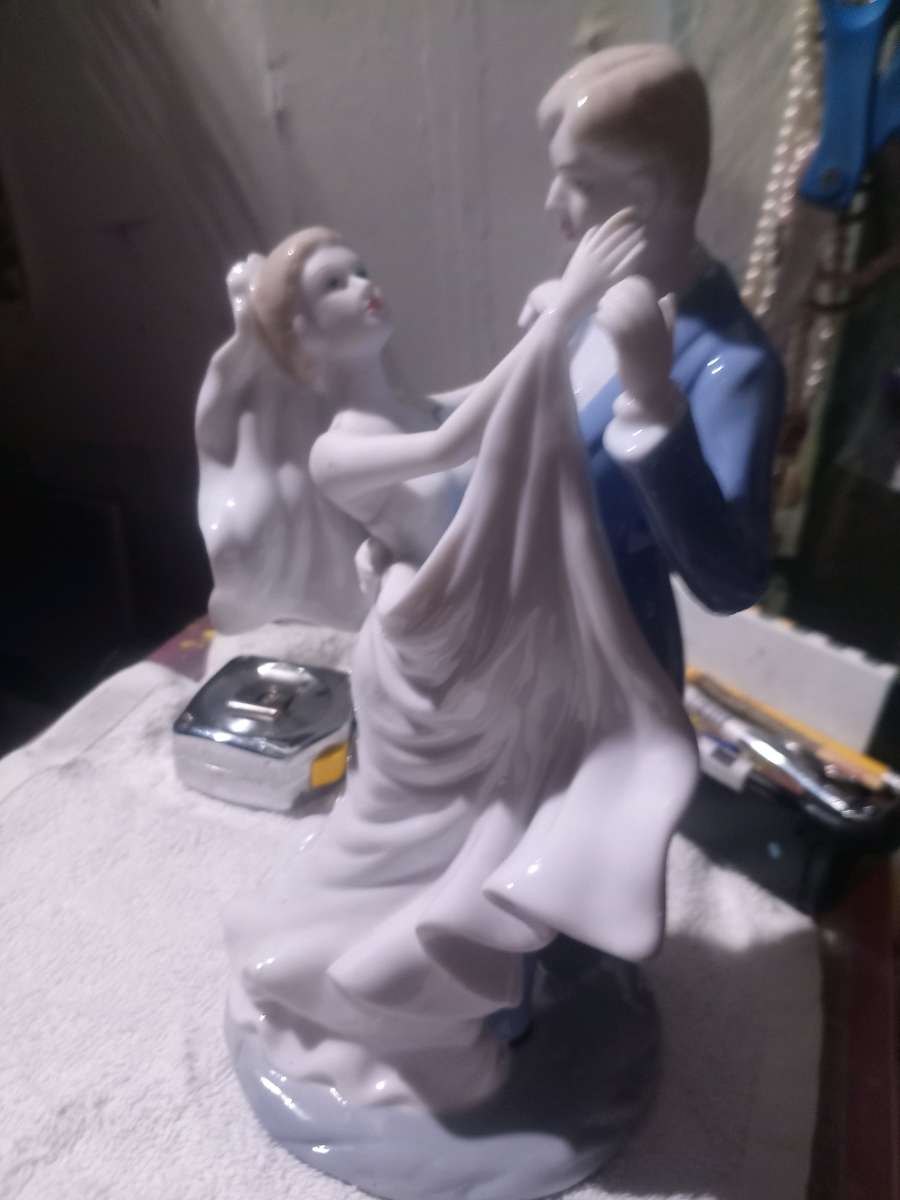 porcelain wedding figurine of man and woman