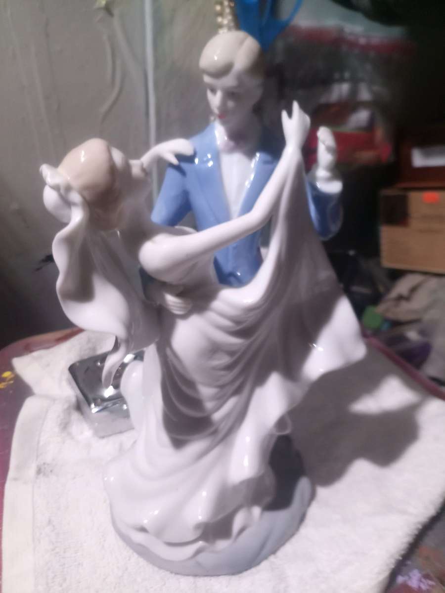 porcelain wedding figurine of man and woman