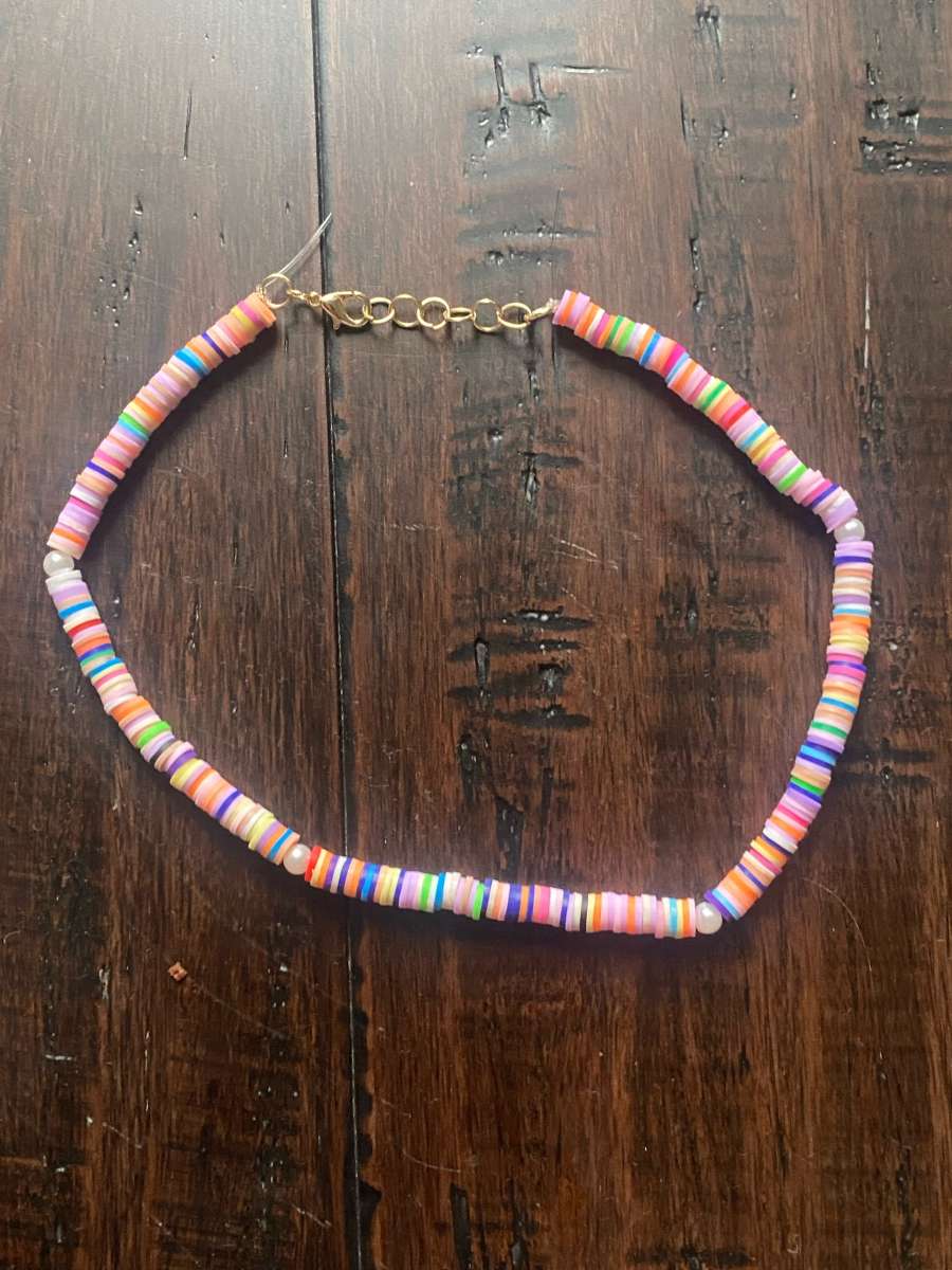 Beachy orangey necklace with pearls with different levels