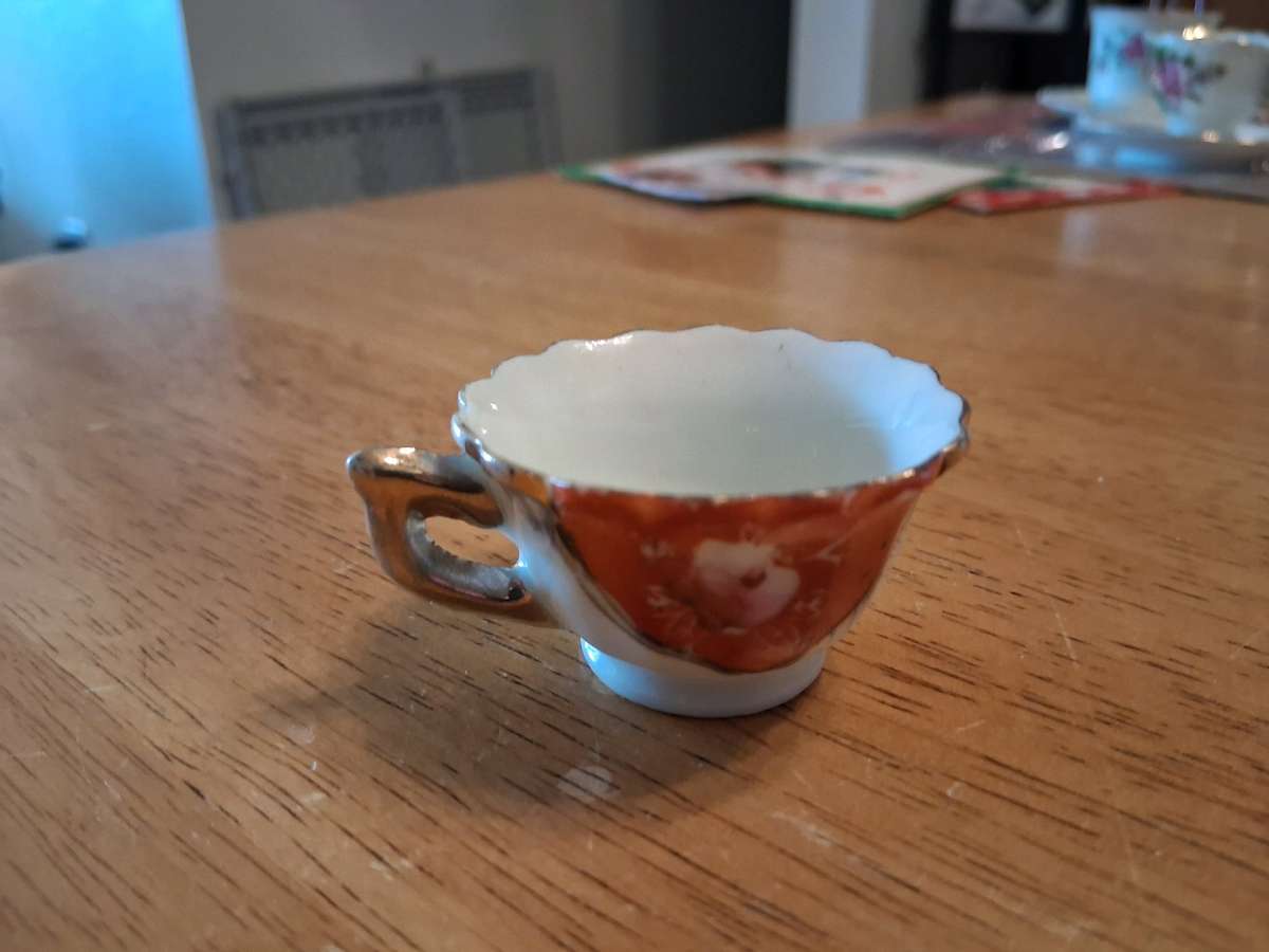 orange and pink flower design tiny teacup