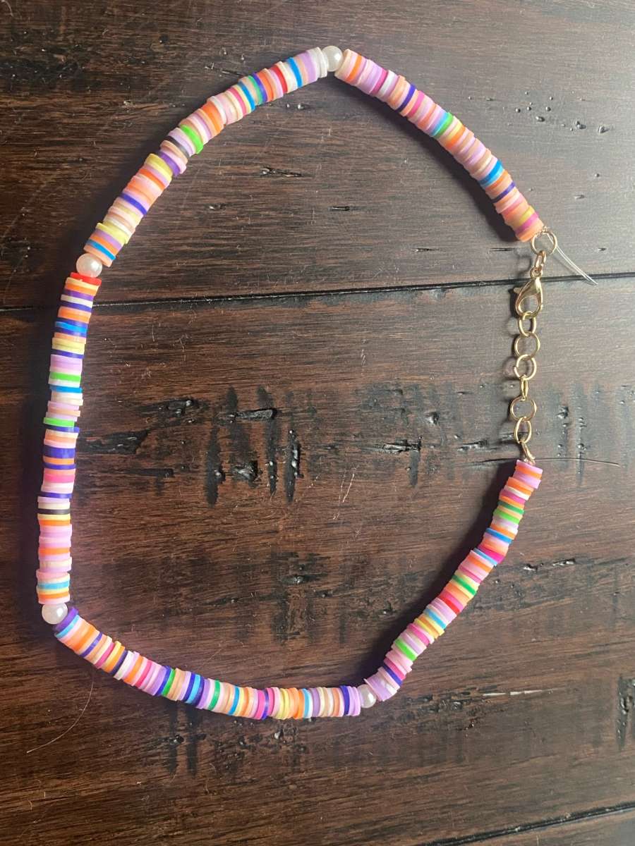 Beachy orangey necklace with pearls with different levels