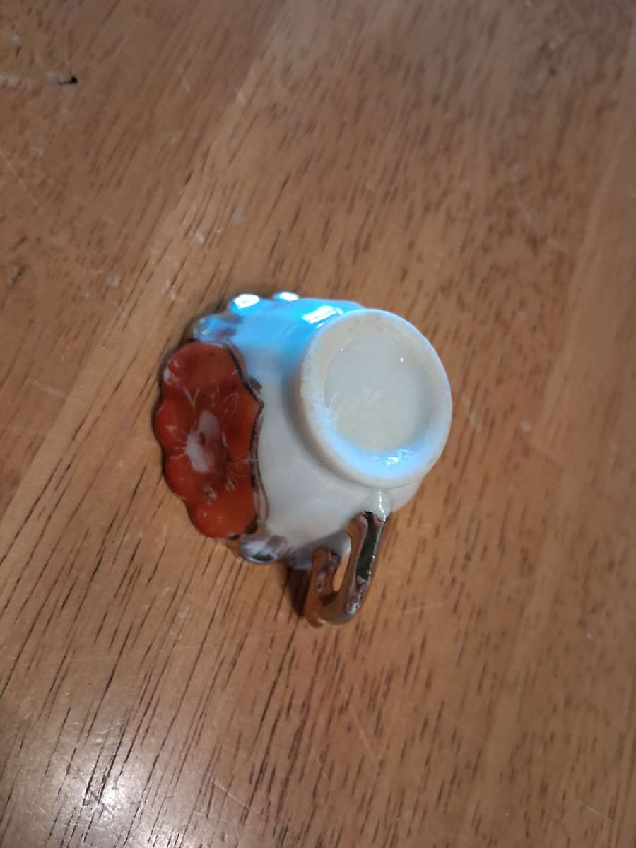 orange and pink flower design tiny teacup