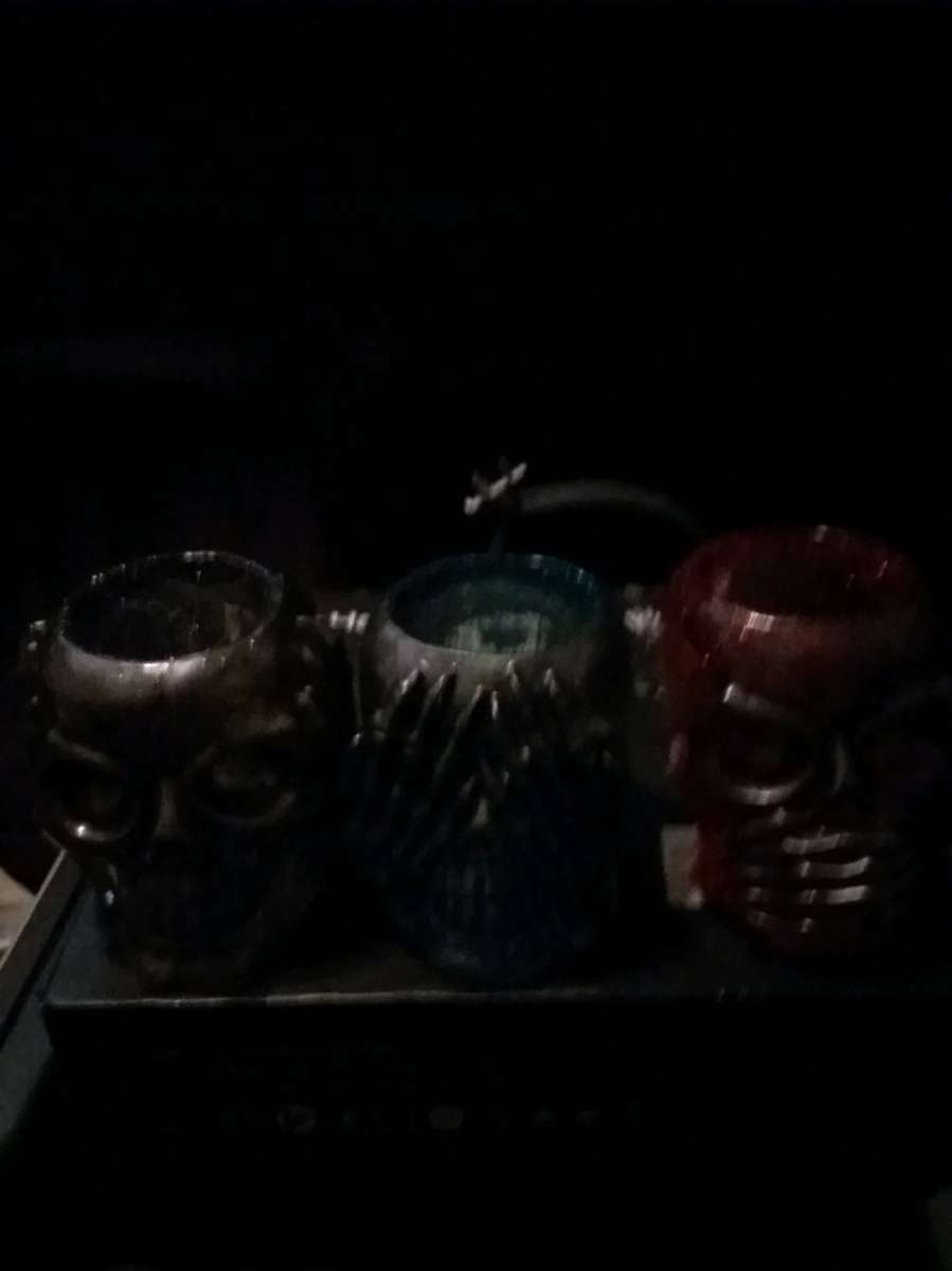 4 different sets of hear see or speak evil candle holders