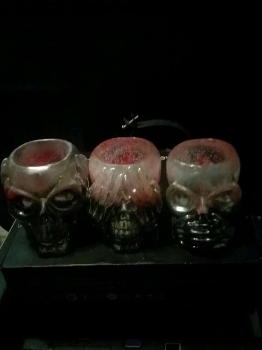 4 different sets of hear see or speak evil candle holders
