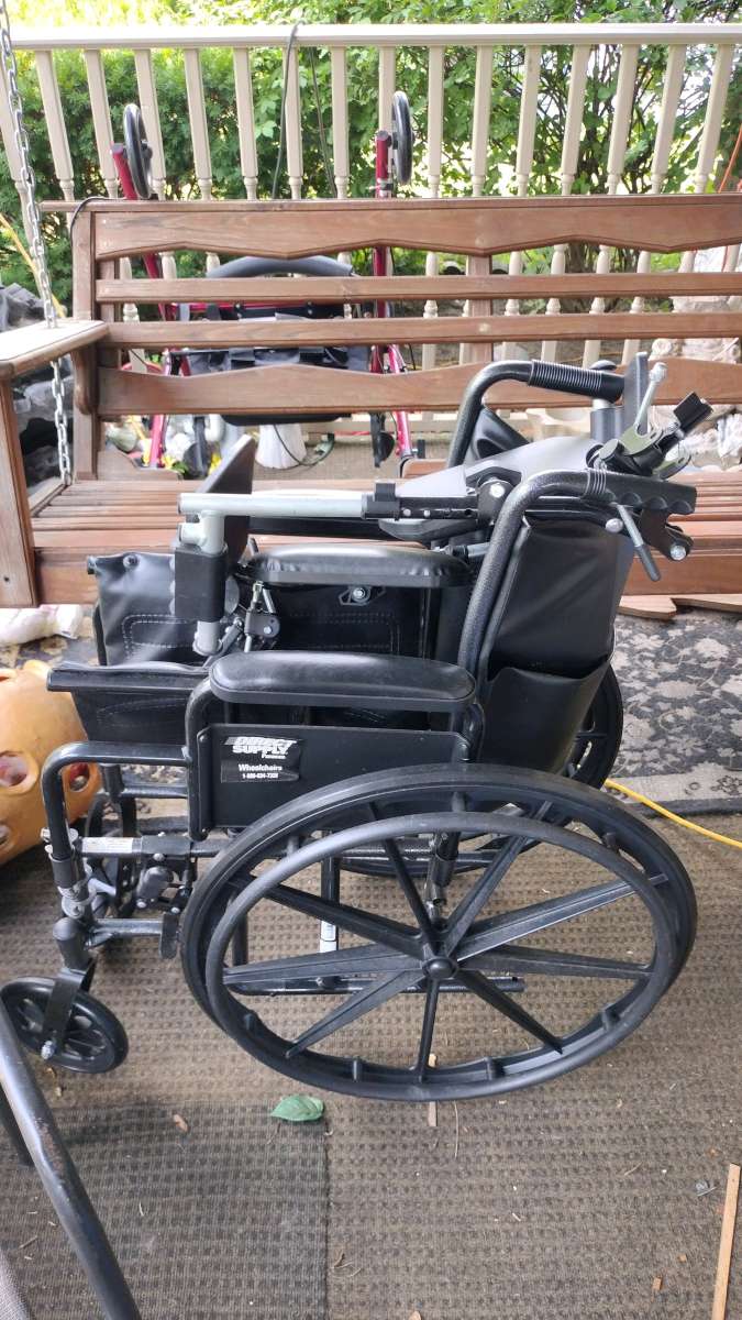 a brand new wheelchair never used that has the foot rest
