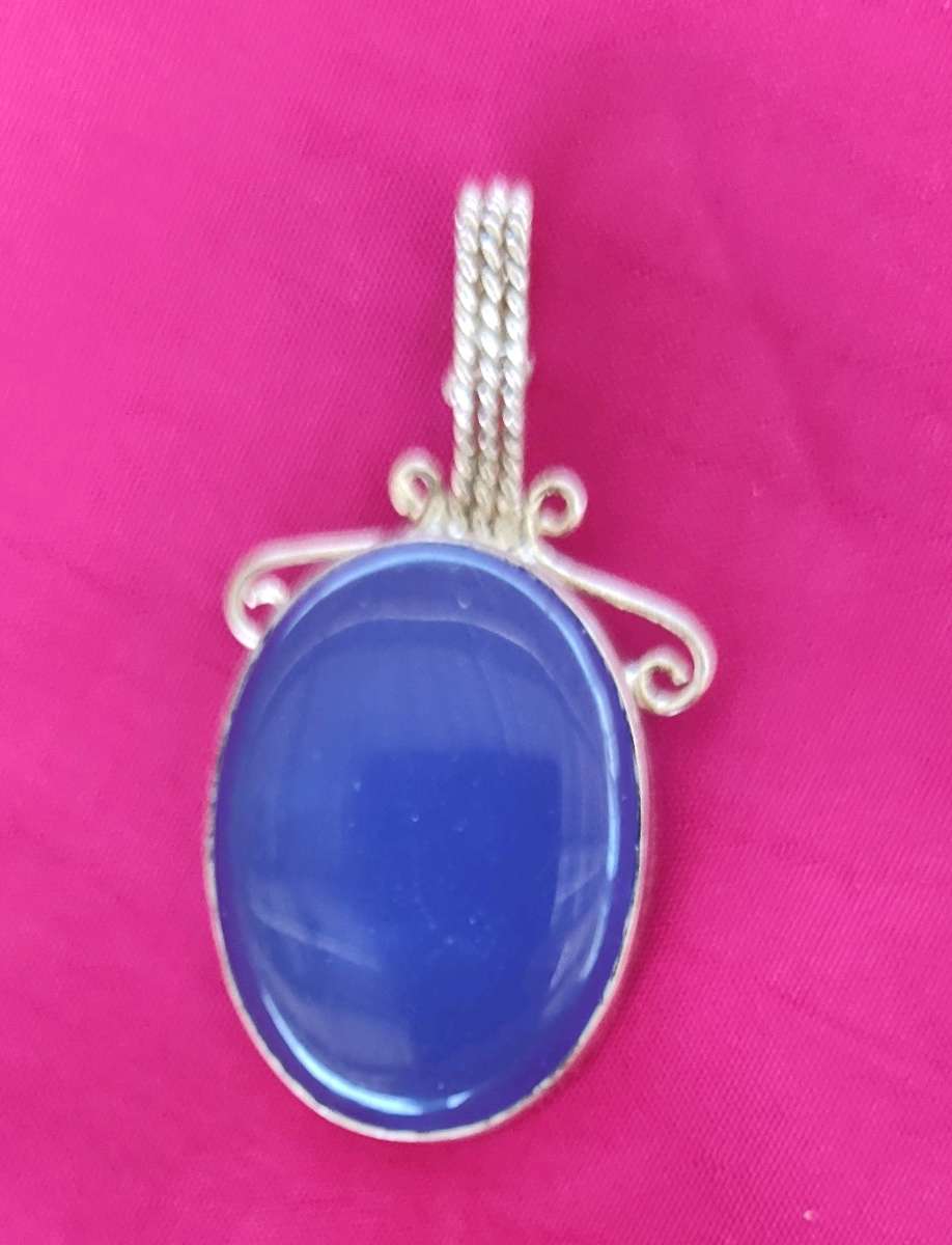 large blue opal cabochon set in sterling silver pendant