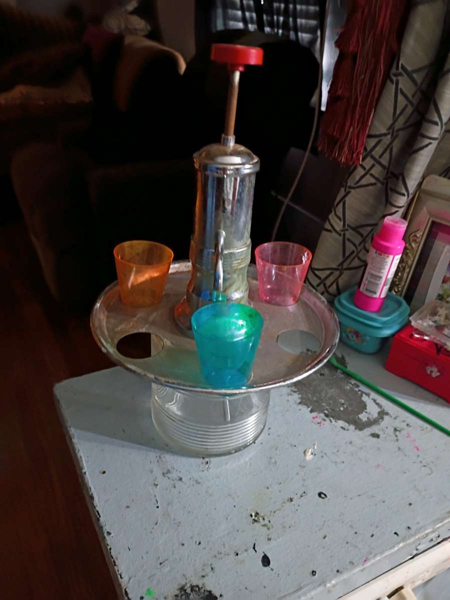 1950 liquor dispenser with shot glasses