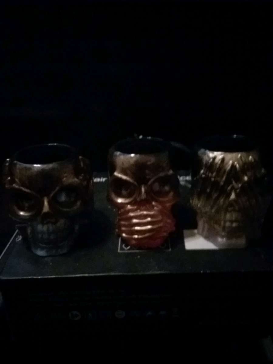 4 different sets of hear see or speak evil candle holders