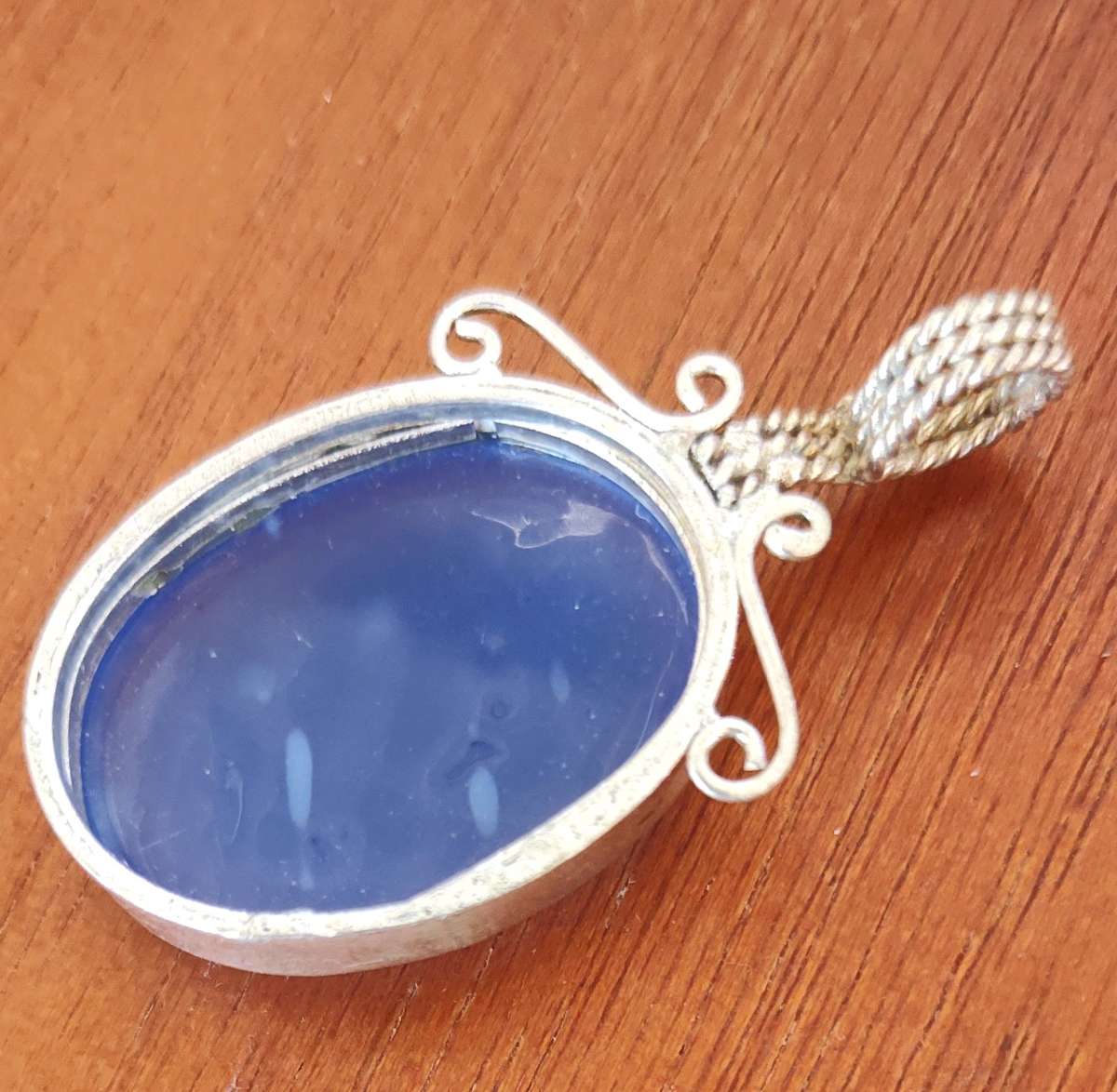 large blue opal cabochon set in sterling silver pendant