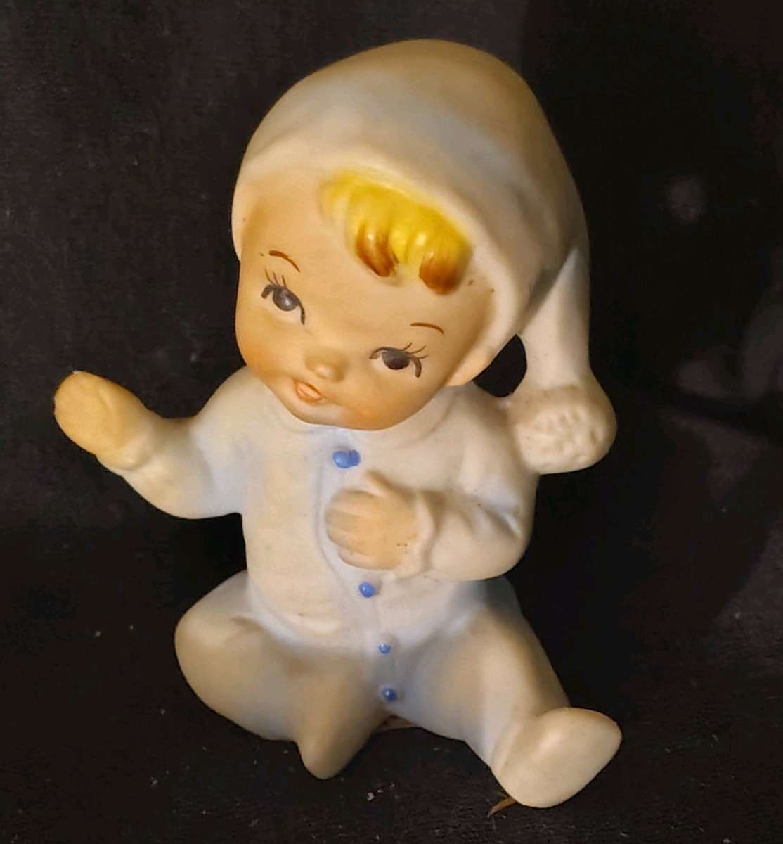 porcelain sitting baby