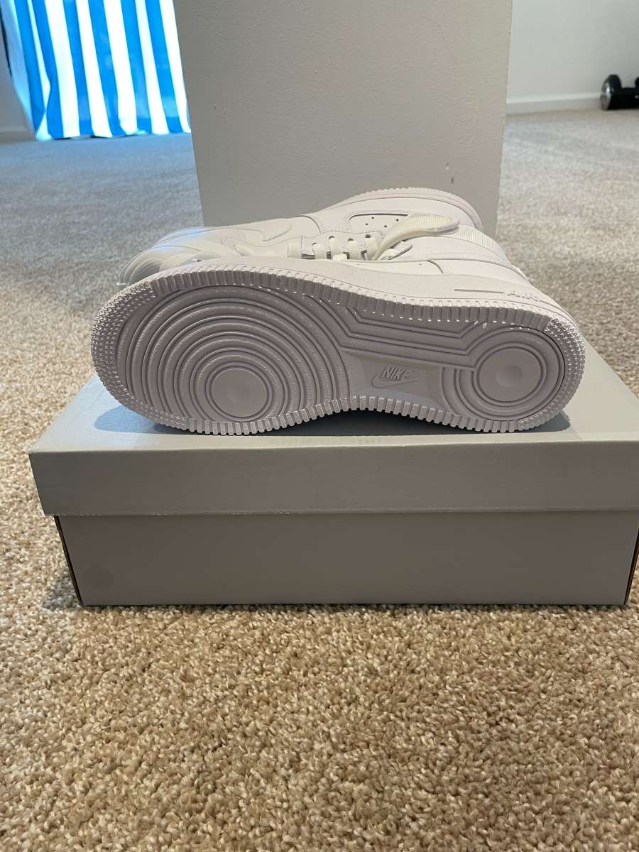 icy white Air Force 1s high