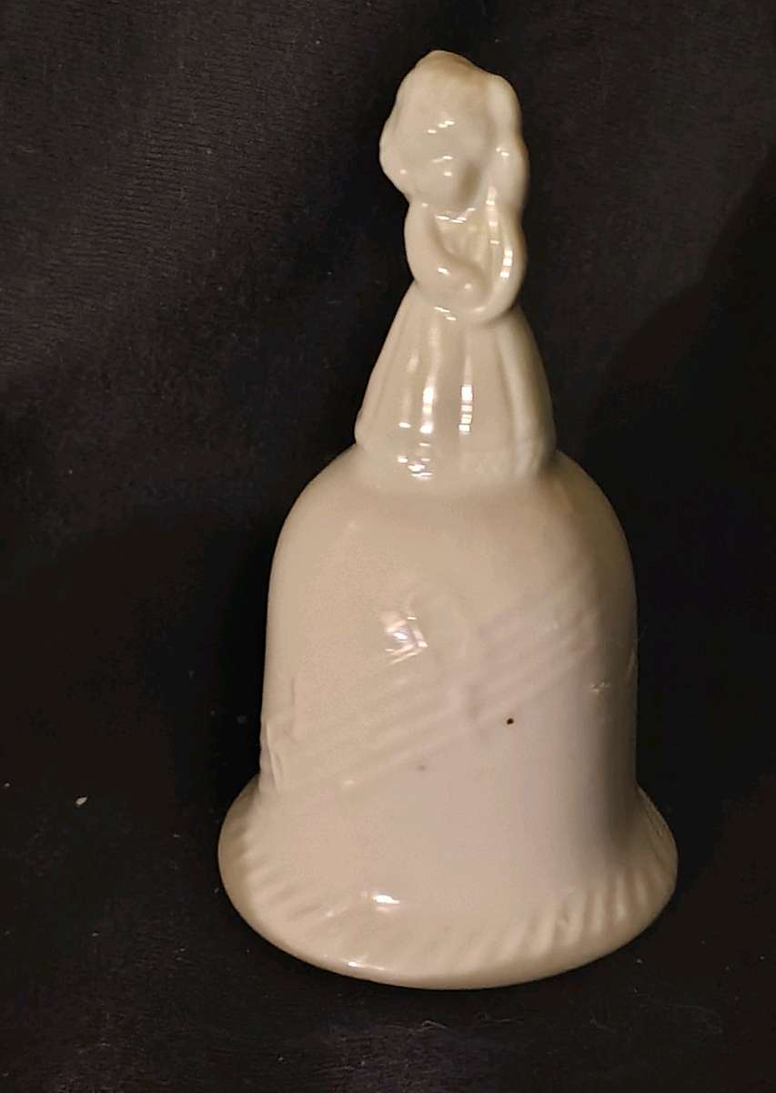 Girl standing on top of Bell