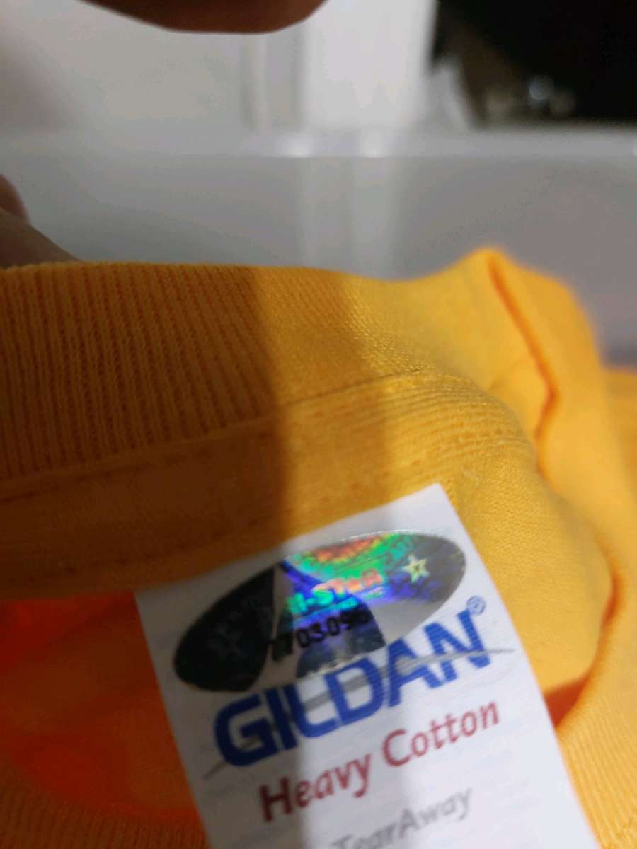 red and yellow autographed Tshirt