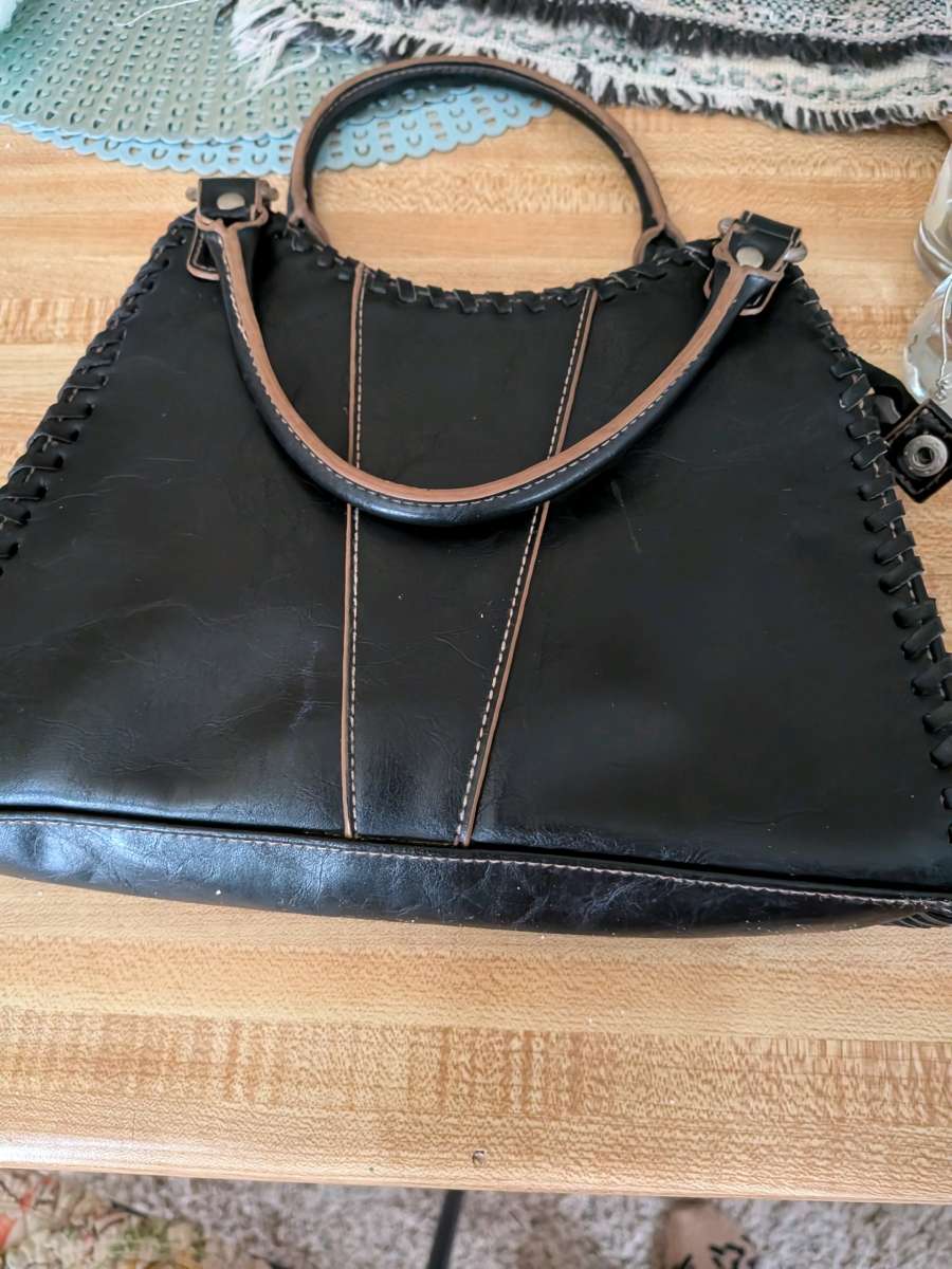 black leather clutch handbag