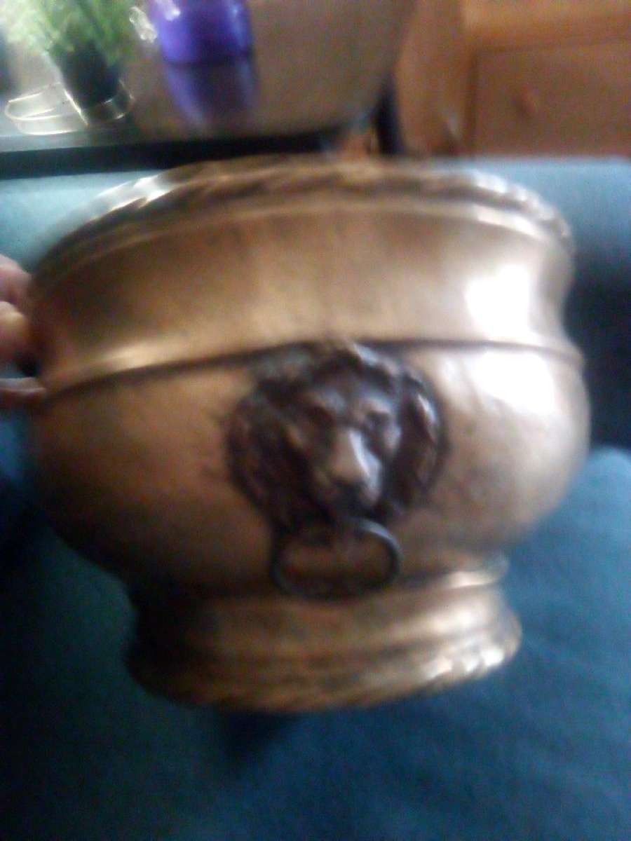 An Antique brass planter