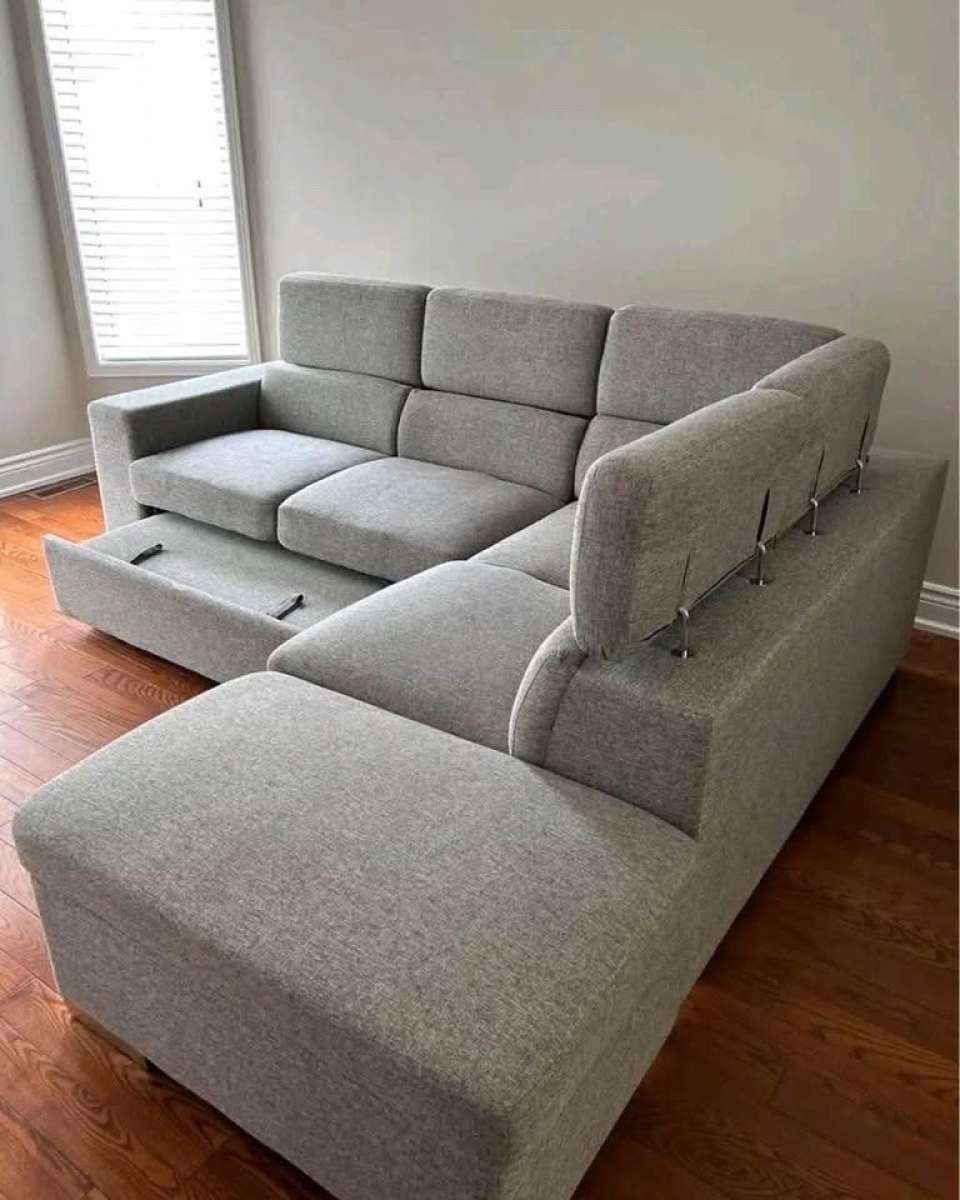 Grey Sectional sofa with pull out bed