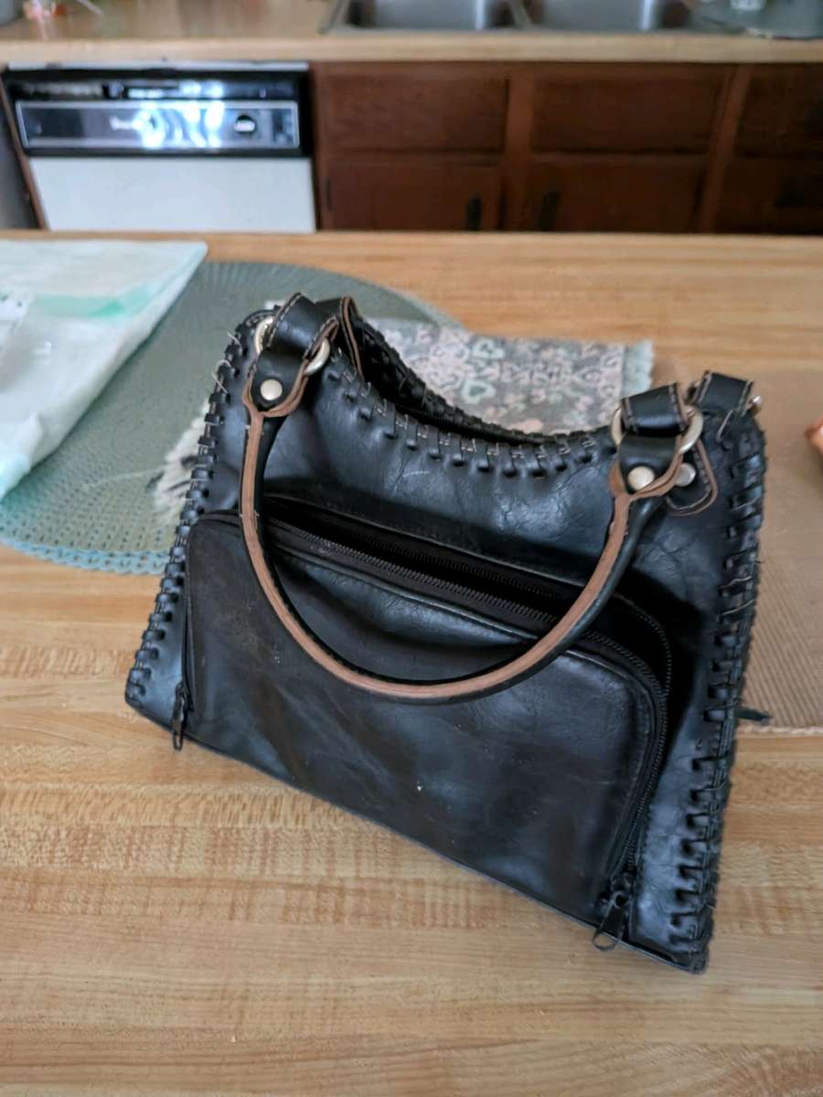 black leather clutch handbag