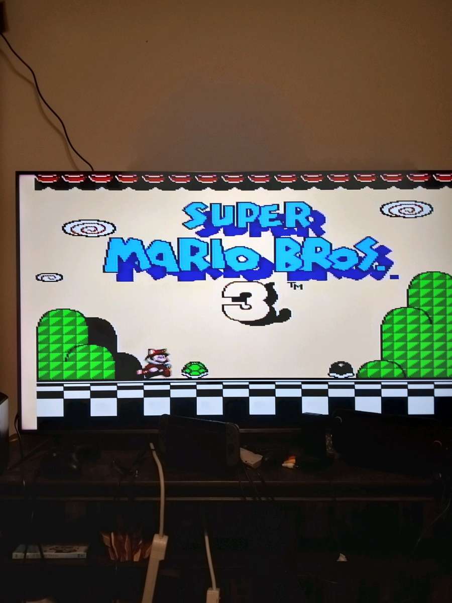 2 Nintendo NES consoles with 3 controllers and 5 games