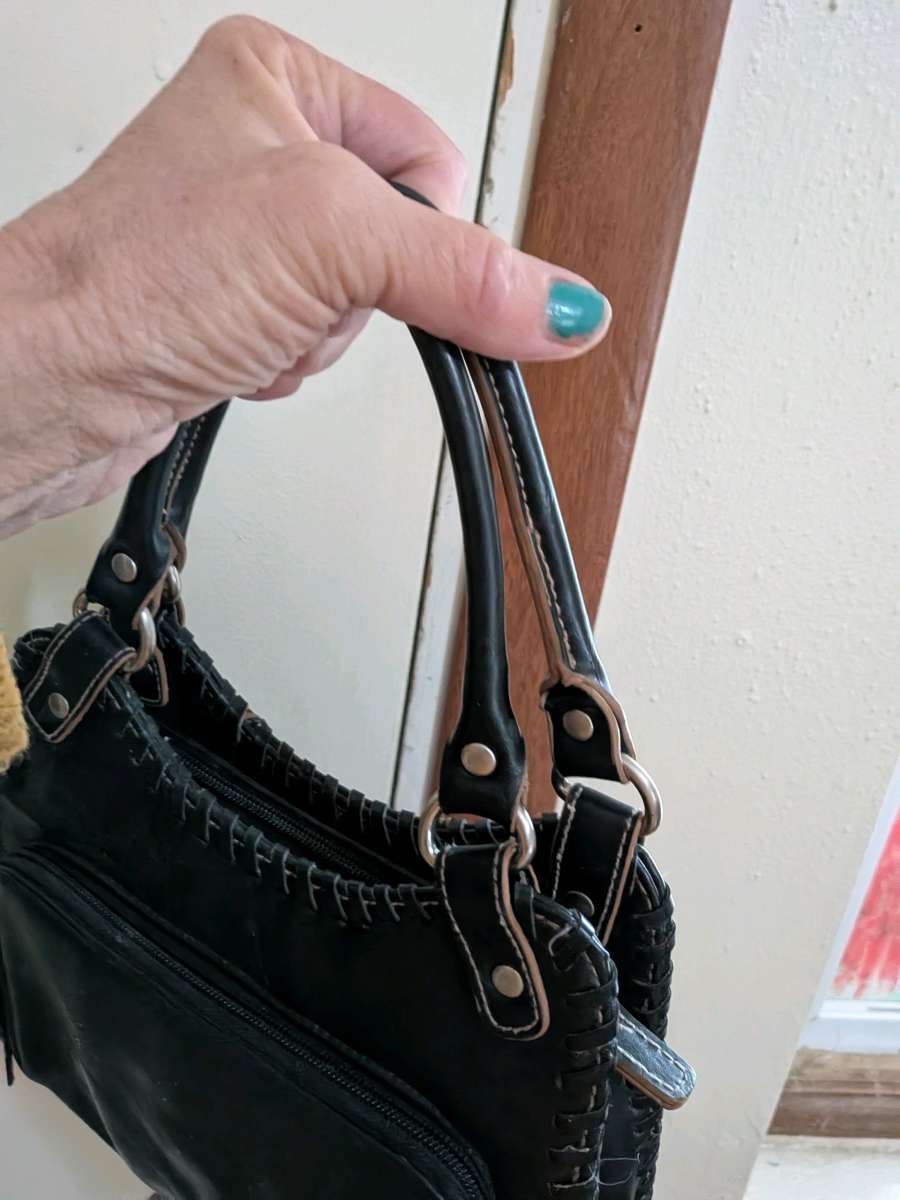 black leather clutch handbag