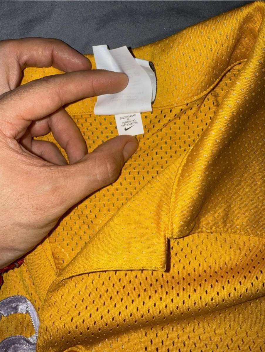yellow Nike shirt