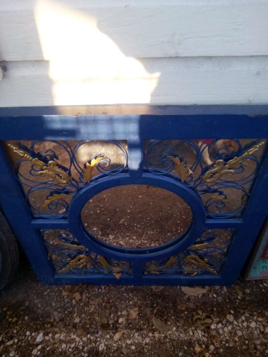 large mirror  small Spanish mirror