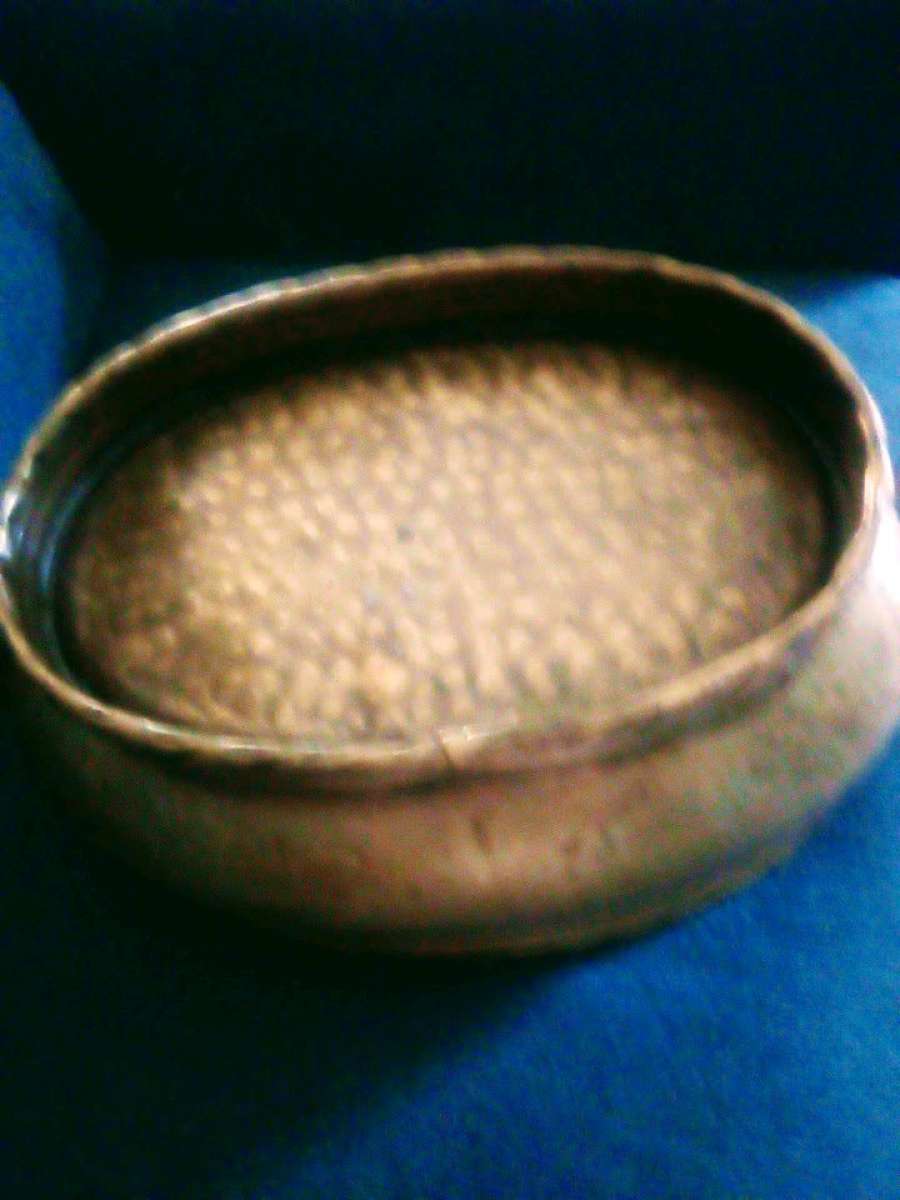 An Antique brass planter