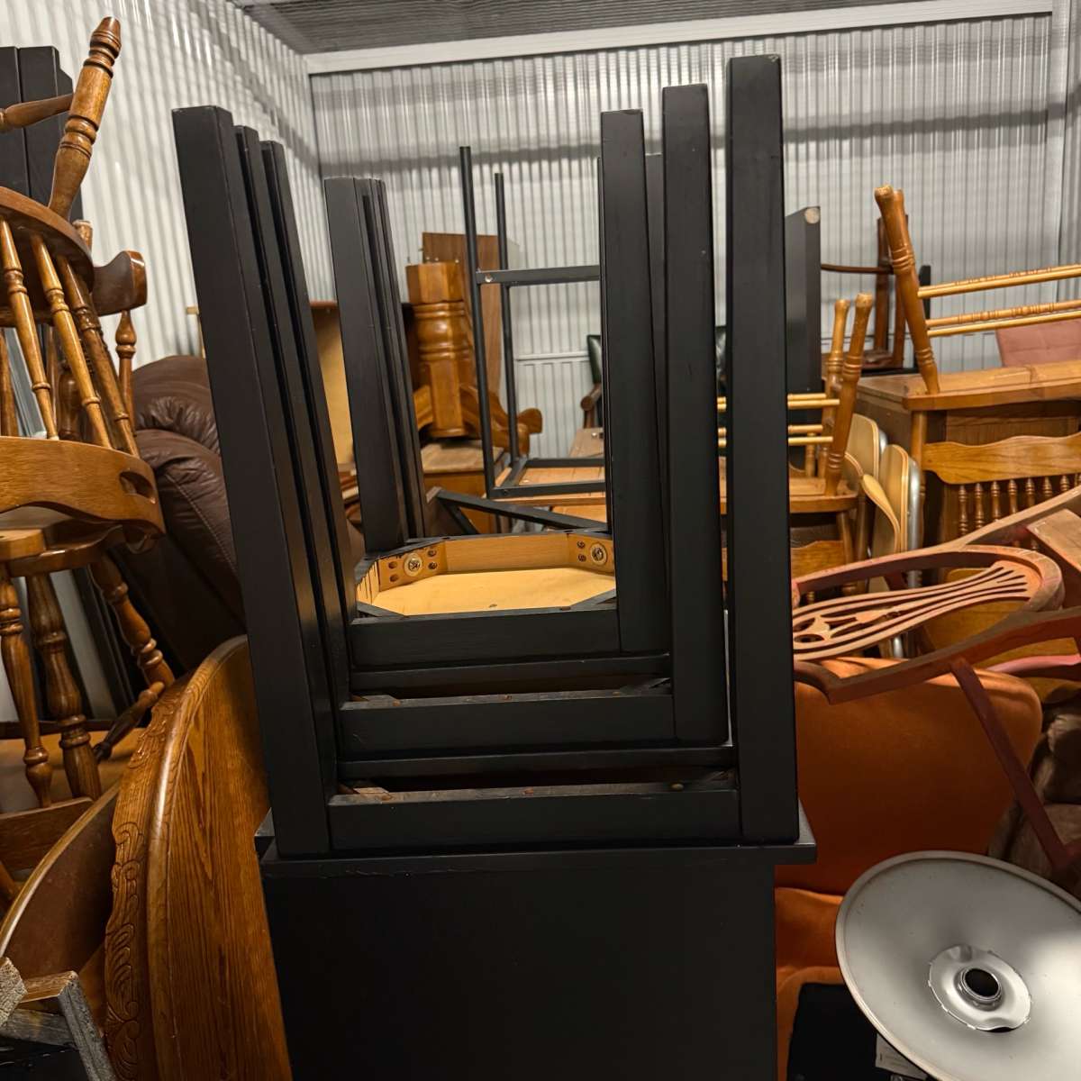 3 black tables slide under the other for easy storing used