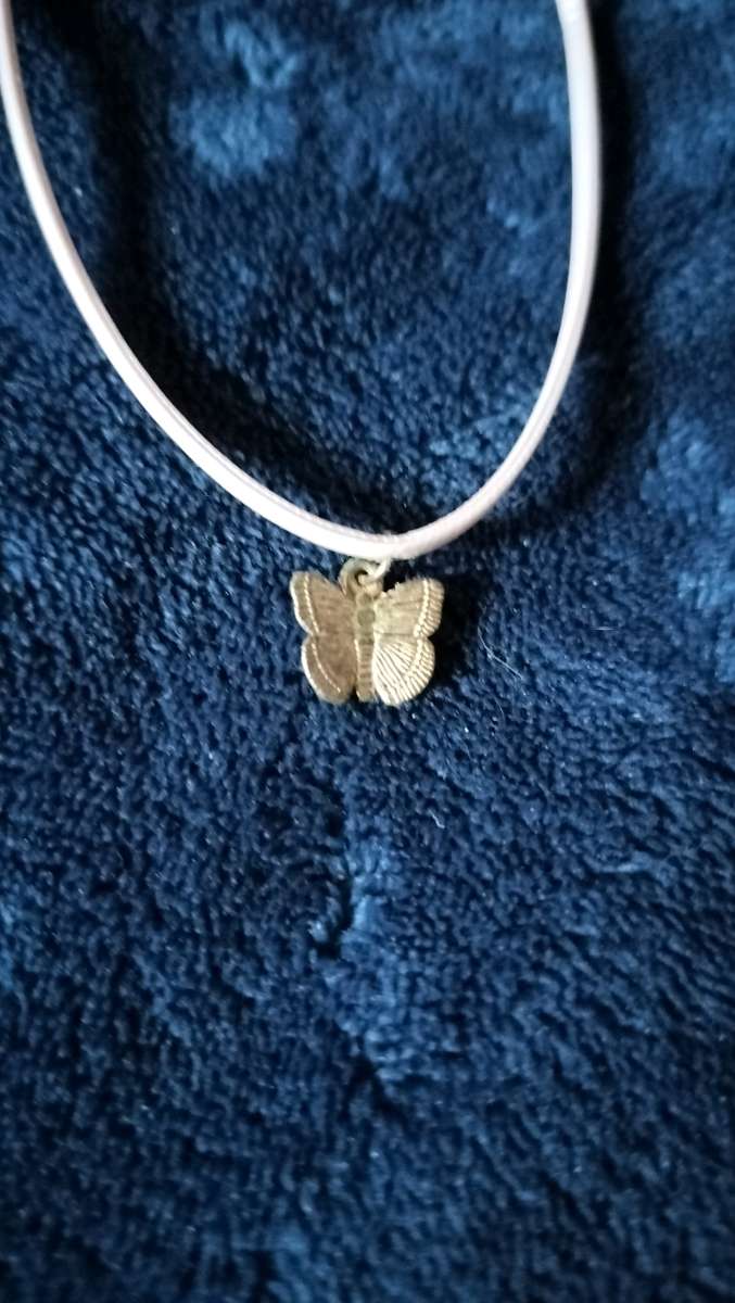 Two choker necklaces and a silver bracelet