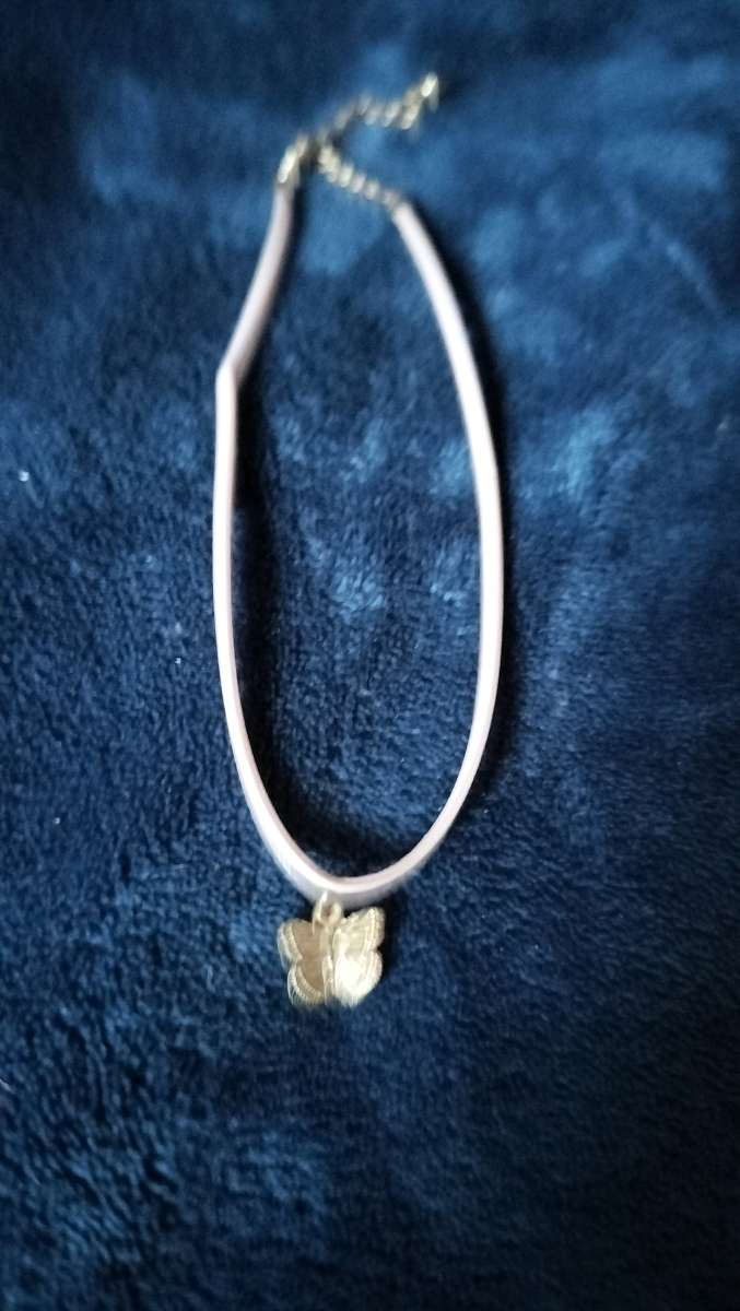 Two choker necklaces and a silver bracelet